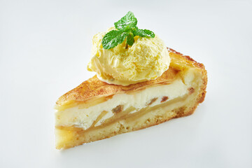 Appetizing apple pie pudding with vanilla ice cream isolated on white background. Close up, selective focus