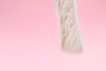 sanitary napkin or sanitary pad for intimate hygiene on a pink background