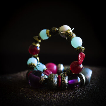 Closeup shot of a colorful necklace with beeds