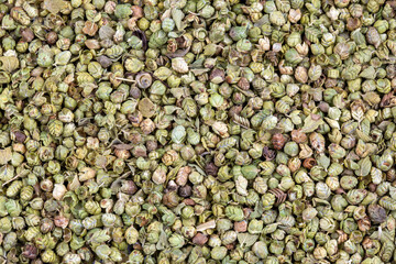 Organic Heap of dried thyme seeds on a background.