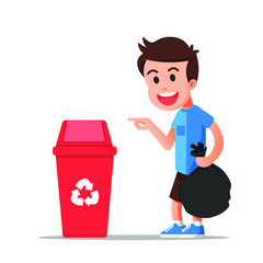 Boy holds the trash and points to the recycling bin