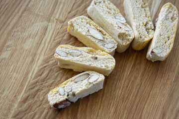 Sweet biscotti cookies with nuts on wooden background. Flat lay