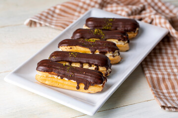 Traditional french eclairs with chocolate.