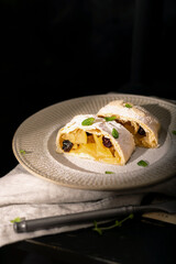 Close up of apple austrian strudel with cinnamon on a plate