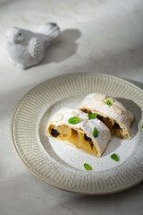 Close up of apple austrian strudel with cinnamon on a plate