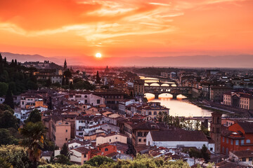 Fototapeta na wymiar Colorful sunset over Florence, the Ponte Vecchio bridge on the Arno river, Florence, Italy