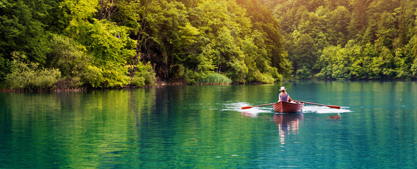 romantic ride in a rowboat in a lake. banner