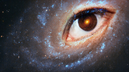 The eye of the clairvoyant in space against the background of the starry sky, the galaxy in the...
