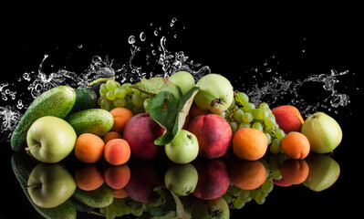 Fototapeta na wymiar water splash fruits and vegetables on a black background, apple, cucumber, apricot, grapes, zucchini, peaches