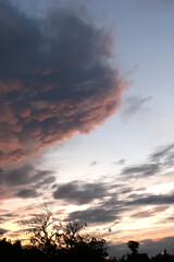 Dark cloudy sky in rainy season with sunlight..