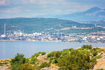 Fototapeta na wymiar Oil refinery near Rijeka, Croatia. Summer landscape and industrial panoramic view