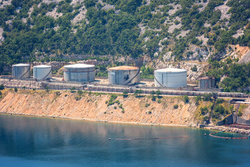 Fototapeta premium Oil refinery near Rijeka, Croatia. Summer landscape and industrial panoramic view