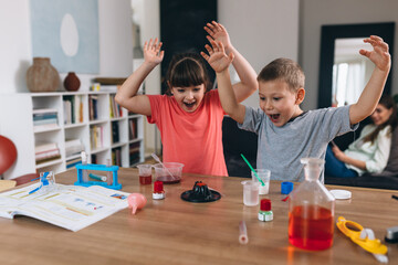brother and sister do chemical experiments at home