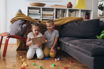 happy young children play at home