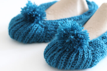 Fototapeta na wymiar hand knitted warm women socks with pompon