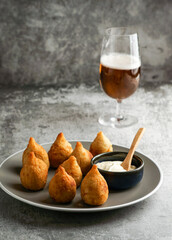 coxinha - popular food in Brazil consisting of chopped or shredded chicken meat covered in dough