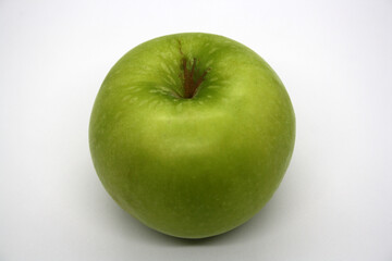 Green ripe apple on a white background.
