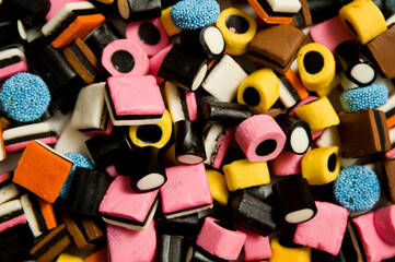 Fototapeta na wymiar Sweet gummies, licorice gums, candies for kids and grown-ups .