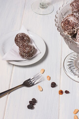 Oats bonbons on a plate and a fork