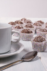 A lot of oats bonbons and a cup