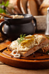 Sandwich with lard and pickled cucumber. Traditionally rendered lard with cracklings and onion.