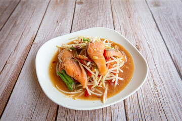 Close up of Spicy Papaya Salad with Salmon.