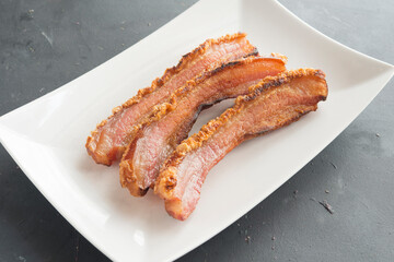 slice of bacon on plate
