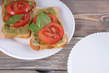Breakfast with sandwiches with guacamole sauce