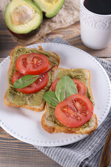 Breakfast with sandwiches with guacamole sauce