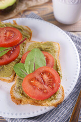 Breakfast with sandwiches with guacamole sauce