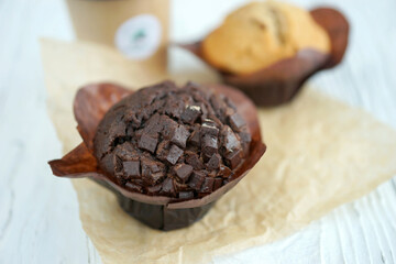 Chocolate and vanilla muffins in paper wrapper