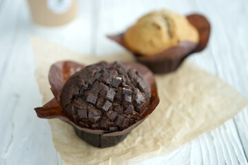 Chocolate and vanilla muffins in paper wrapper