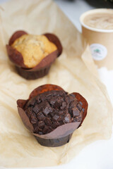 Chocolate and vanilla muffins in paper wrapper