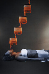 Blue skinned young woman's body being warmed up by orange and liquid chemical elements pouring down in her mouth, bringing her back to life, in front of a grey background