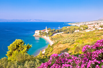 Bol on Brac island. Monastery on pebble beach in Bol view