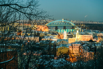 Fototapeta na wymiar Night winter view of the old historical Podil district of the Kyiv city, Ukraine.
