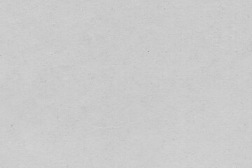 Cardboard gray texture close-up. Light old paper background. Grunge concrete wall. Vintage blank wallpaper.