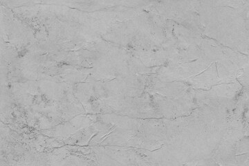 Cardboard gray texture close-up. Light old paper background. Grunge concrete wall. Vintage blank wallpaper.