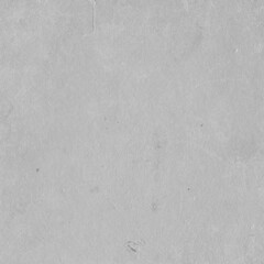 Cardboard gray texture close-up. Light old paper background. Grunge concrete wall. Vintage blank wallpaper.