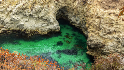A beautiful landscape, view the clear ocean water on a rocky seaside at Point Lobos State Reserve in Carmel, California.