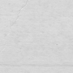 Cardboard gray texture close-up. Light old paper background. Grunge concrete wall. Vintage blank wallpaper.