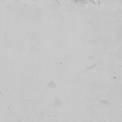 Cardboard gray texture close-up. Light old paper background. Grunge concrete wall. Vintage blank wallpaper.