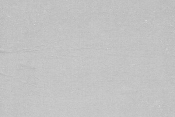 Cardboard gray texture close-up. Light old paper background. Grunge concrete wall. Vintage blank wallpaper.