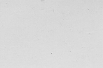 Cardboard gray texture close-up. Light old paper background. Grunge concrete wall. Vintage blank wallpaper.