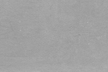 Cardboard gray texture close-up. Light old paper background. Grunge concrete wall. Vintage blank wallpaper.