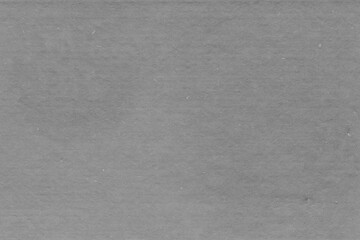 Cardboard gray texture close-up. Light old paper background. Grunge concrete wall. Vintage blank wallpaper.