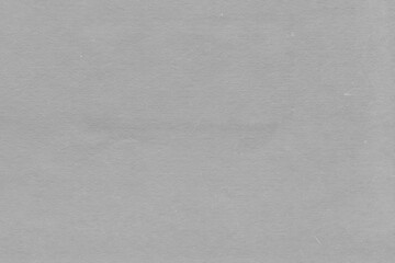 Cardboard gray texture close-up. Light old paper background. Grunge concrete wall. Vintage blank wallpaper.