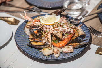 Plate in restaurant with mediterranean seafood.