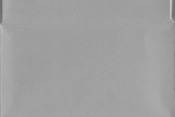 Cardboard gray texture close-up. Light old paper background. Grunge concrete wall. Vintage blank wallpaper.