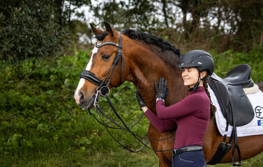 Woman dressage rider and her wonderful Lusitano horse, Azores island, Sao Miguel.	